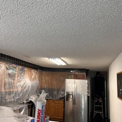 Blythe Building & Construction - Before picture of popcorn ceiling demo, emergency call.