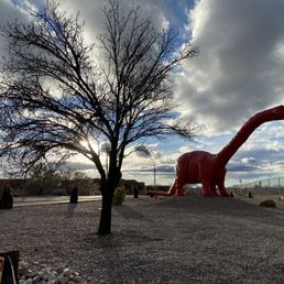 Large Red Dinosaur by the self storage
