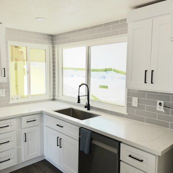 Sarmento Bros Construction - Modern kitchen remodel with shaker cabinets, quartz countertops, subway tile backsplash, undermount sink, and matte black fixtures. - General Contractors Near Me Sarmento Bros Construction - Modern kitchen remodel with shaker cabinets, quartz countertops, subway tile backsplash, undermount sink, and matte black fixtures. - General Contractors Near Me
