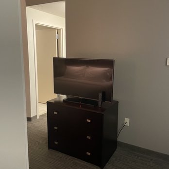 SpringHill Suites by Marriott Naples - 318 tv on small dresser to be able to view from the couch or the king sized bed - Hotels Near Me - Naples, Florida