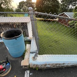 Scheidler Solutions - Bent chain link fence post before we replaced the post