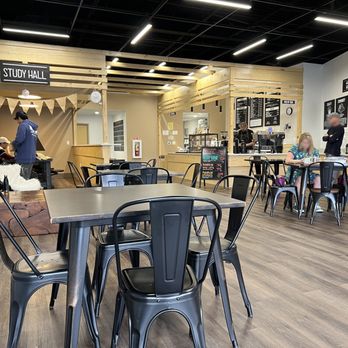 Ark Coffeehaus - A view from a small table on the left of the entrance looking in. The study hall in on the back left and the counter on the back right. - Coffee & Tea Near Me - Dunwoody, Georgia