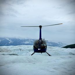 Helicopter landing on the glacier Helicopter landing on the glacier