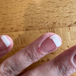 Va Nail And Spa - Crap French manicure and nicked cuticle.