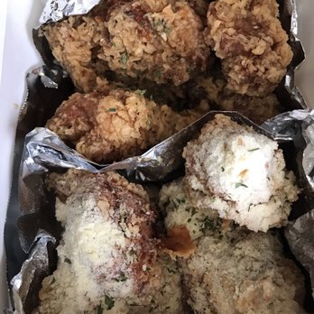 Crunchicken - Shot of the open container of half and half chicken; honey garlic top, cheese garlic bottom. - Korean Near Me - Cypress, California