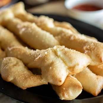 Pizza Factory - a plate of french fries and dipping sauce - Pizza Near Me - Cameron Park, California Pizza Factory - a plate of french fries and dipping sauce - Pizza Near Me - Cameron Park, California