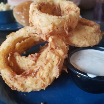MOJO Hogtown Bar-B-Que - Side of onion rings with dipping sauce - Barbeque Near Me - Gainesville, Florida