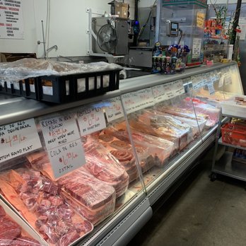 Carniceria El Paisano - Other end of meat case... and. The cart full of fresh salsas - Meat Shops Near Me - Seattle, Washington