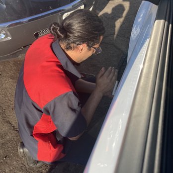 Bedford Auto Center - Taha patching my tire with the quickness! Sweet man with amazing customer service - Auto Repair Near Me - Bedford, Texas