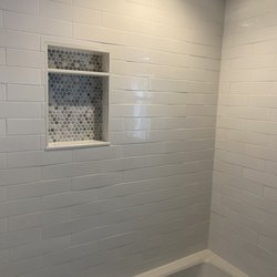 Floor and Decor - Nashua - The tile should be flat and as you can see the tile is bowed and not uniform.