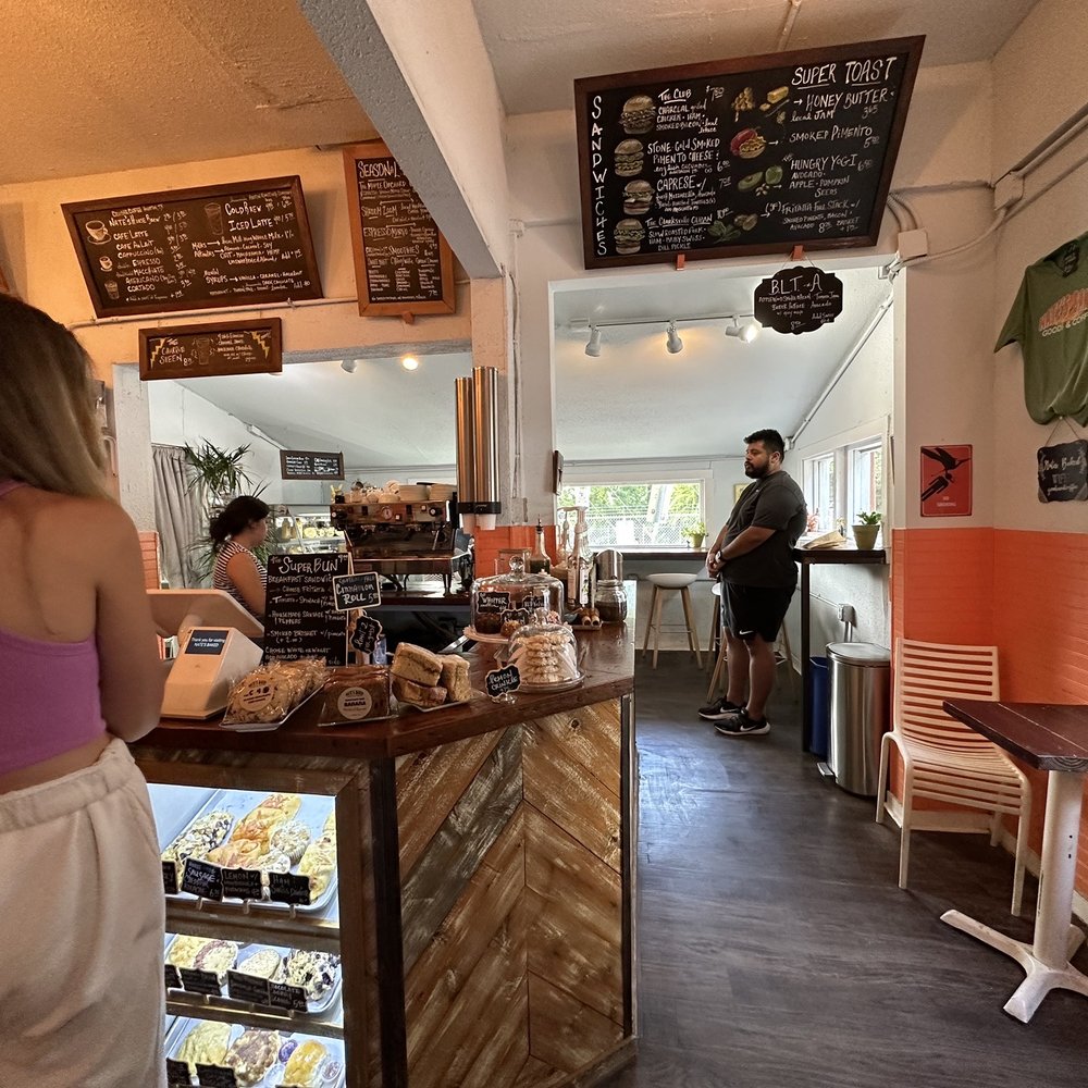 Nate's Baked Goods & Coffee - a woman standing at the counter - Coffee & Tea Near Me - Austin, Texas Nate's Baked Goods & Coffee - a woman standing at the counter - Coffee & Tea Near Me - Austin, Texas