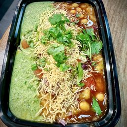 Samosa Chaat... a savory blend of samosa pieces topped with tangy chaat spices. (One of my favorite dishes here!)