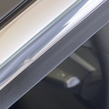 Enhanced Automotive - Chip on the chrome from my left window from his tint job! - Vehicle Wraps Near Me - San Diego, California