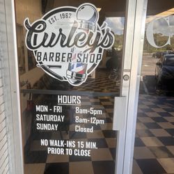 Curleys Barber Shop - Front door and hours