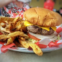 Flo's 66 Diner - Cheeseburger with French fries. Nice and thick with homemade fries.