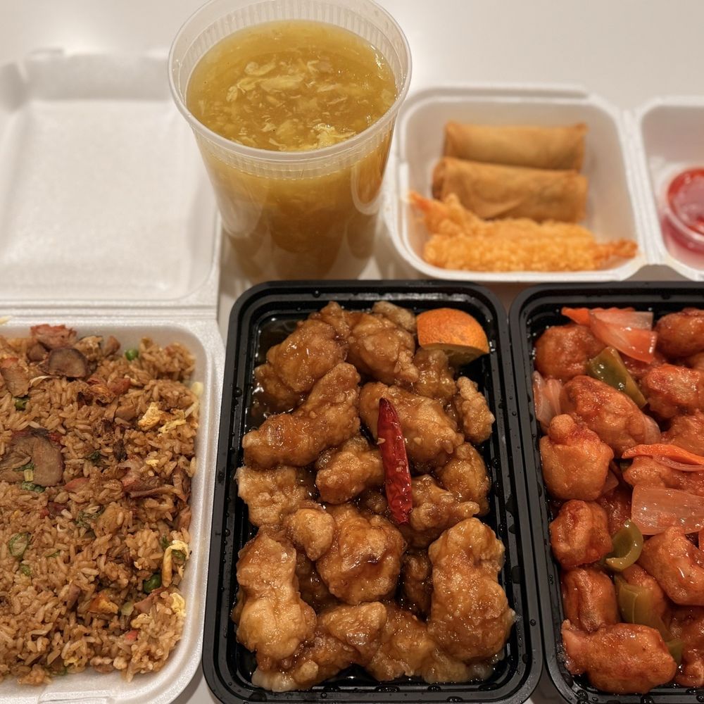 Family Dinner A w/ BBQ Pork Fried Rice, Egg Flower Soup, Orange Chicken, Sweet & Sour Pork.