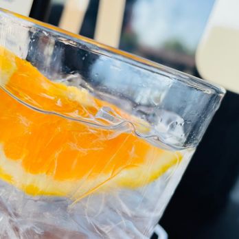 SPICE ROOM - an orange slice in a glass of water - Indian Near Me - Denver, Colorado SPICE ROOM - an orange slice in a glass of water - Indian Near Me - Denver, Colorado