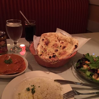 Saffron Grill - butter chicken dish served with rice, garlic naan bread, house salad, and a coke - Indian Near Me - Seattle, Washington