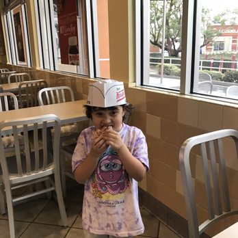 Krispy Kreme - She's diggin' this classic doughnut - Donuts Near Me - Orange, California