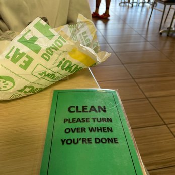 Subway - a green sign on a table that says clean please turn over when you're done - Sandwiches Near Me - Hannibal, Missouri