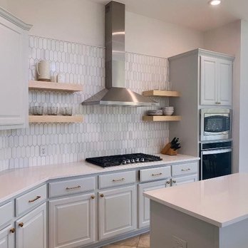 Herbert H. Construction - a kitchen with white cabinets and stainless steel appliances - General Contractors Near Me - San Antonio, Texas Herbert H. Construction - a kitchen with white cabinets and stainless steel appliances - General Contractors Near Me - San Antonio, Texas