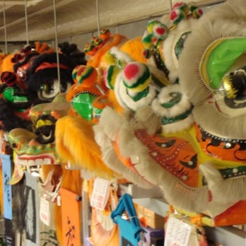 Pearl River Mart - Row of lions' heads ready for a parade - Fashion Near Me - New York, New York Pearl River Mart - Row of lions' heads ready for a parade - Fashion Near Me - New York, New York
