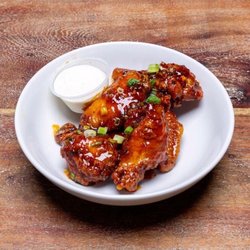 Paisans Pizzeria - West Lawn - Jumbo wings tossed in Paisans Sweet and Spicy Dragon Sauce