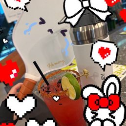 Bloody Mary, water bottle, and pickleball paddle