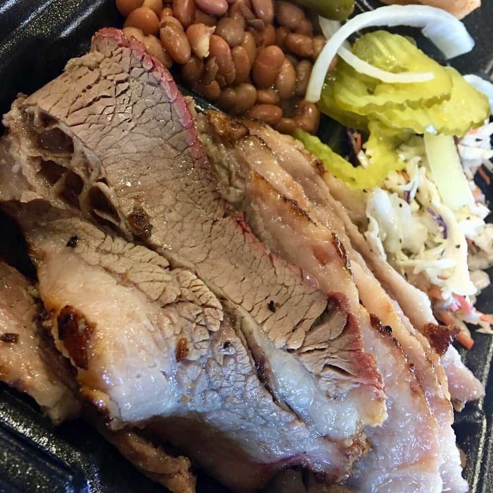 pork, beans, pickles, and a sandwich pork, beans, pickles, and a sandwich