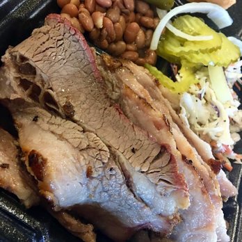 Partners BBQ - pork, beans, pickles, and a sandwich - Barbeque Near Me - Karnes City, Texas