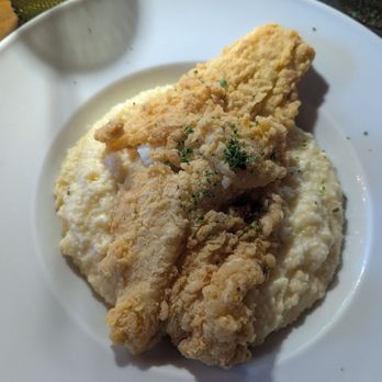 1123 by Chef Tobias - Fish and grits. I asked for the crawfish sauce to be placed on the side - Breakfast & Brunch Near Me - Hyattsville, Maryland