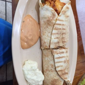 Manara Cafe - Chicken sharwarma wrap, grilled with a pickle yum, very filling. - Mediterranean Near Me - Lubbock, Texas