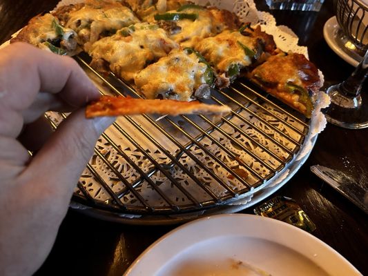 Photo of Traverso's Restaurant - Naperville, IL, US. Look how thin and crispy the pizza crust is