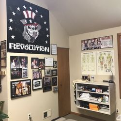 Joseph De Carlo, DC, CCSP - Dr. De Carlo's wall featuring his family and their academic and athletic accomplishments.