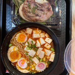 Tofu spicy ramen and half order of pork Pork Chachu Bun Tofu spicy ramen and half order of pork Pork Chachu Bun