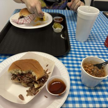 Ida V's Smoke Palace - Me and my friend eating their Texas Brisket. He has Broccoli and cheese on the side, while I have baked beans (they were pretty good). - Food Trucks Near Me - Granbury, Texas Ida V's Smoke Palace - Me and my friend eating their Texas Brisket. He has Broccoli and cheese on the side, while I have baked beans (they were pretty good). - Food Trucks Near Me - Granbury, Texas