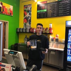 juiceology - Juice bar with friendly Morgan the owner/manager making one of his healthy specialties