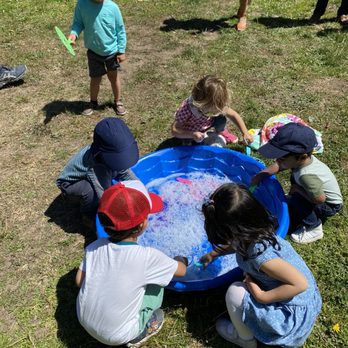 Miss Molly Bubbles - Children making their own bubbles - Magicians Near Me