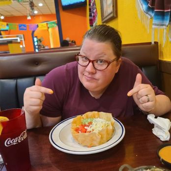 Tequila's - a woman sitting at a table with a plate of food - Mexican Near Me - Versailles, Indiana