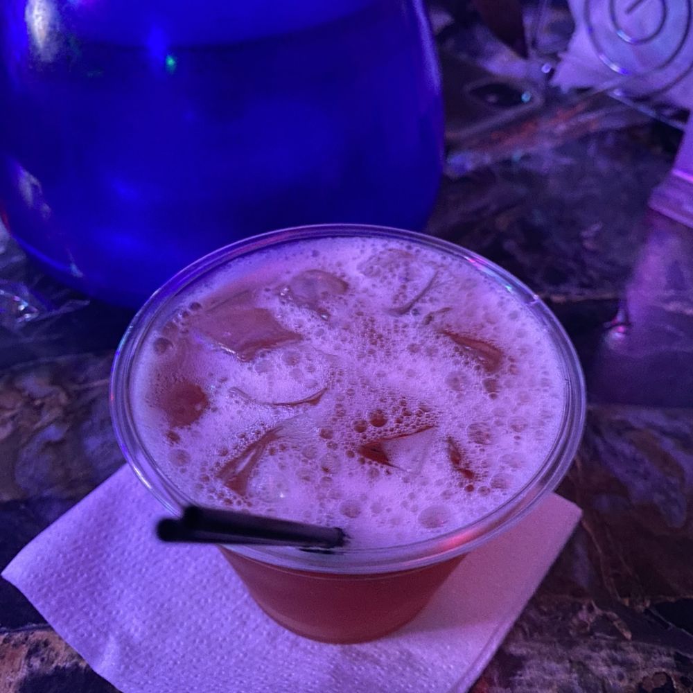 a drink in a plastic cup a drink in a plastic cup