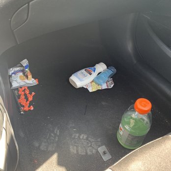 Fix Auto Redlands - Photo of my center console items on the floor as well as the foot print. - Body Shops Near Me - Redlands, California Fix Auto Redlands - Photo of my center console items on the floor as well as the foot print. - Body Shops Near Me - Redlands, California
