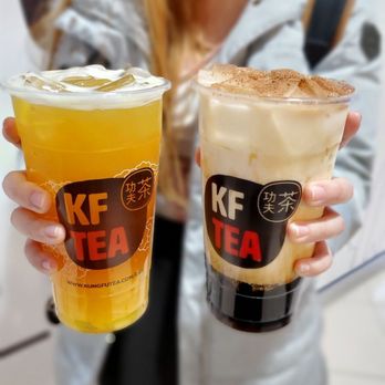 Kung Fu Tea - a woman holding two cups of tea - Bubble Tea Near Me - Edmonton, Alberta Kung Fu Tea - a woman holding two cups of tea - Bubble Tea Near Me - Edmonton, Alberta