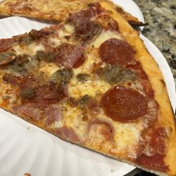 Marina's Pizza - Meat Lovers Pizza slice and plain slice
