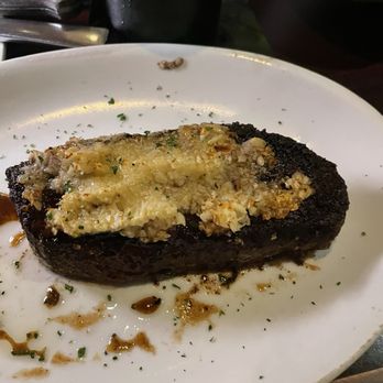 Arrowhead Grill - Roasted garlic encrusted topping- I love garlic, but it was a bit much for me. I scraped some off and it was tasty. - Seafood Near Me - Glendale, Arizona
