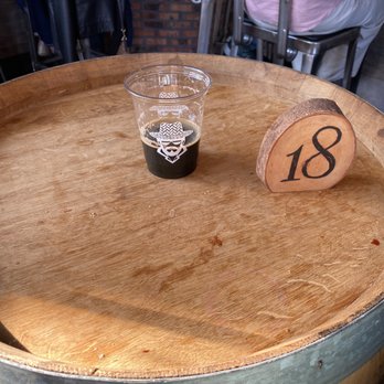 Lost Farmer Brewing - Barrel table - Breweries Near Me - Westbury, New York