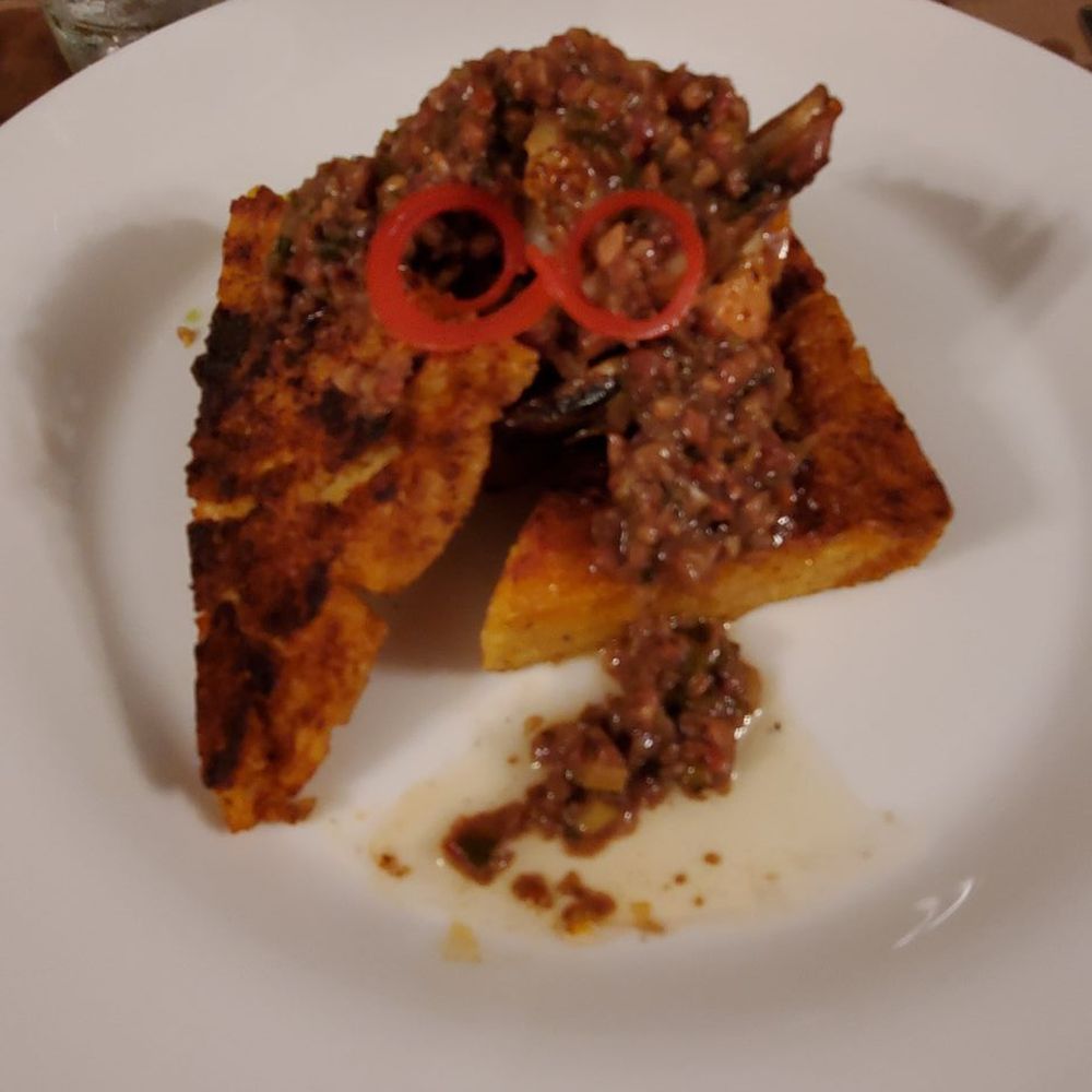 Boucherie - Blackened shrimp and grit cake - Barbeque Near Me - New Orleans, Louisiana Boucherie - Blackened shrimp and grit cake - Barbeque Near Me - New Orleans, Louisiana