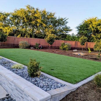 Santo Tomas Landscape - Final product of the sod removal and artificial turf installation - with drains and sprinklers. - Landscaping Near Me Santo Tomas Landscape - Final product of the sod removal and artificial turf installation - with drains and sprinklers. - Landscaping Near Me