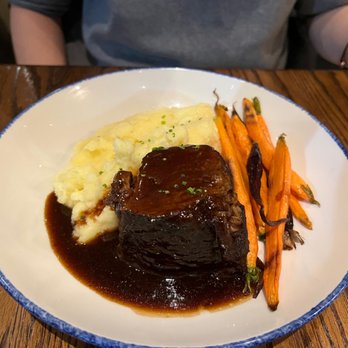 Simeon's On The Commons - Guinness braised short rib with roasted garlic mash potatoes and herb roasted baby carrots - New American Near Me - Ithaca, New York