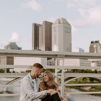 Bicentennial Park - engagement photos with columbus downtown skyline on main street bridge - Parks Near Me - Columbus, Ohio