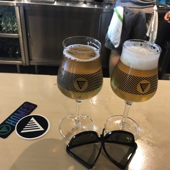 Homes Brewery - Two hands, two beers - Breweries Near Me - Ann Arbor, Michigan